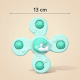 Een productafbeelding van een octopus-vormige bijtring of speelgoed in de kleur roze. De ring heeft een afmeting van 13 cm.